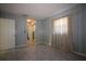 Spacious bedroom with two windows and an attached bathroom at 1444 Eastfield Dr, Clearwater, FL 33764