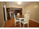 Cozy dining room with hardwood floors and a ceiling fan for comfortable meals at 1444 Eastfield Dr, Clearwater, FL 33764