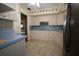 Well-lit kitchen boasting plenty of cabinets, tile floors, and modern appliances at 1444 Eastfield Dr, Clearwater, FL 33764