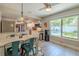 Bright dining room with backyard views, connected to kitchen for easy access at 1503 Albemarle Ct, Dunedin, FL 34698