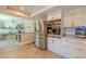 Bright kitchen featuring stainless steel appliances, wood floors, and white subway tile backsplash at 1503 Albemarle Ct, Dunedin, FL 34698