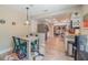 Kitchen nook featuring a colorful rug, seating for four, and views into the connected kitchen at 1503 Albemarle Ct, Dunedin, FL 34698