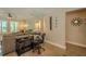 Comfortable living room offers plenty of natural light and a dedicated workspace at 1503 Albemarle Ct, Dunedin, FL 34698
