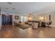 Bright living room featuring an open floor plan with hardwood floors at 1503 Albemarle Ct, Dunedin, FL 34698