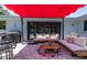 Outdoor patio area for relaxing and entertaining with comfortable seating and a grill at 1503 Albemarle Ct, Dunedin, FL 34698