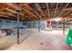 Unfinished basement featuring exposed beams and sand floor; great for storage at 1514 Florida Ave, Palm Harbor, FL 34683