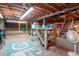 Unfinished basement featuring open ceiling and concrete floor with Colts logo painted at 1514 Florida Ave, Palm Harbor, FL 34683