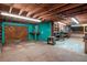 Unfinished basement with exposed wood ceiling, painted walls, and concrete floors at 1514 Florida Ave, Palm Harbor, FL 34683