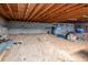 Spacious unfinished basement featuring sand floors and exposed beams at 1514 Florida Ave, Palm Harbor, FL 34683