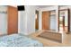 This bedroom features closet space, a TV, and wooden laminate flooring at 1514 Florida Ave, Palm Harbor, FL 34683