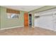 Cozy bedroom with neutral tones, closet space, and a window offering ample natural light at 1514 Florida Ave, Palm Harbor, FL 34683