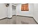 Minimalist bedroom with tile flooring, large window, and ample closet space at 1514 Florida Ave, Palm Harbor, FL 34683