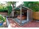 Outdoor living space featuring a hot tub nestled under a pergola at 1514 Florida Ave, Palm Harbor, FL 34683