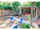 Backyard featuring a covered hot tub and privacy fence. Also includes a seating area at 1514 Florida Ave, Palm Harbor, FL 34683