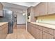Kitchen featuring wooden cabinets, butcher block countertops, and a black refrigerator at 1514 Florida Ave, Palm Harbor, FL 34683