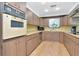 Well-lit kitchen featuring butcher block countertops, wooden cabinetry, and stainless steel appliances at 1514 Florida Ave, Palm Harbor, FL 34683