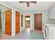 Functional laundry area with modern appliances, storage, and convenient access to the adjacent rooms at 1514 Florida Ave, Palm Harbor, FL 34683