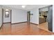 Bright living room featuring hardwood floors and an open layout to the kitchen at 1514 Florida Ave, Palm Harbor, FL 34683