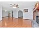 Open living room with hardwood floors, stone fireplace, and natural light at 1514 Florida Ave, Palm Harbor, FL 34683