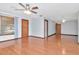 Open living room with hardwood floors, ceiling fan, and bright natural light at 1514 Florida Ave, Palm Harbor, FL 34683