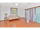 Cozy living room featuring hardwood floors and natural light, great for relaxation at 1514 Florida Ave, Palm Harbor, FL 34683
