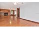 Living room featuring hardwood floors, a wood-burning fireplace, and lots of natural light at 1514 Florida Ave, Palm Harbor, FL 34683