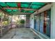 Relaxing screened patio with stone floors and views of the backyard at 1514 Florida Ave, Palm Harbor, FL 34683