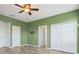 This airy bedroom boasts wood-look floors, fresh paint and adjacent closet and bathroom access at 15711 Starling Dale Ln, Lithia, FL 33547
