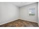 A bright bedroom featuring decorative floors and a window providing natural light at 15711 Starling Dale Ln, Lithia, FL 33547