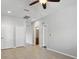 Spacious bedroom featuring tile floors and multiple entry points at 15711 Starling Dale Ln, Lithia, FL 33547