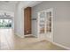 An entryway features modern wood plank decor and an open doorway at 15711 Starling Dale Ln, Lithia, FL 33547