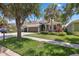 Beautiful home with a three-car garage, vibrant landscaping, and a charming curb appeal at 15711 Starling Dale Ln, Lithia, FL 33547