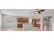 Open concept kitchen with wood cabinetry, granite countertops, and stainless steel appliances at 15711 Starling Dale Ln, Lithia, FL 33547