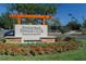 FishHawk Ranch Tennis Club sign amidst a beautifully landscaped community entrance at 15711 Starling Dale Ln, Lithia, FL 33547