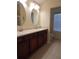 Spacious bathroom featuring double sinks, vanity, and tile flooring at 16618 Kingletside Ct, Lithia, FL 33547