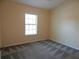 Neutral bedroom with window and carpet at 16618 Kingletside Ct, Lithia, FL 33547