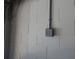 Close up of the garage wall showing concrete blocks and electrical fixtures at 16618 Kingletside Ct, Lithia, FL 33547