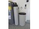 Garage mechanicals including water heater, water softener, and pressure tank at 16618 Kingletside Ct, Lithia, FL 33547
