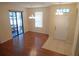 Open-concept living room features a sliding glass door, stylish lighting, and tile entry at 16618 Kingletside Ct, Lithia, FL 33547