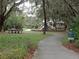 Community playground with slides, benches, and a covered picnic area at 16618 Kingletside Ct, Lithia, FL 33547