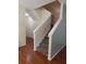 Carpeted staircase featuring neutral paint and wood-look flooring at 16618 Kingletside Ct, Lithia, FL 33547