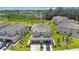 Beautiful aerial view of newly constructed townhomes with manicured lawns and attached garages at 1897 Trailside Dr, Palm Harbor, FL 34683