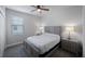 This bedroom features a ceiling fan and light gray carpet flooring at 1897 Trailside Dr, Palm Harbor, FL 34683