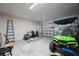 Spacious garage with a green golf cart and plenty of storage at 1897 Trailside Dr, Palm Harbor, FL 34683