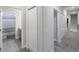 Upstairs hallway with closets and bathroom at 1897 Trailside Dr, Palm Harbor, FL 34683