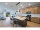 Modern kitchen featuring a large island with bar seating and pendant lighting at 1897 Trailside Dr, Palm Harbor, FL 34683