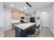 Modern kitchen featuring quartz countertops, a center island, and stainless steel appliances at 1897 Trailside Dr, Palm Harbor, FL 34683
