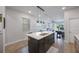 Modern kitchen with large island, stainless appliances, and an open floor plan at 1897 Trailside Dr, Palm Harbor, FL 34683