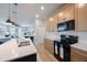 Bright kitchen with modern appliances and view to the back patio at 1897 Trailside Dr, Palm Harbor, FL 34683