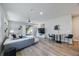 Bright living room with modern furnishings and sliding glass doors leading to the backyard at 1897 Trailside Dr, Palm Harbor, FL 34683